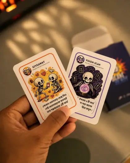A hand holding the Giveaway and Vision Scan cards