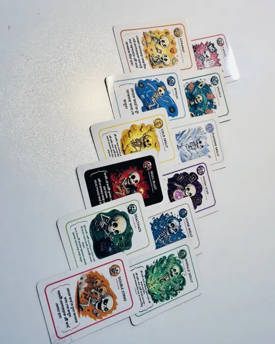 Bone Blast cards laid out in two rows on a white table