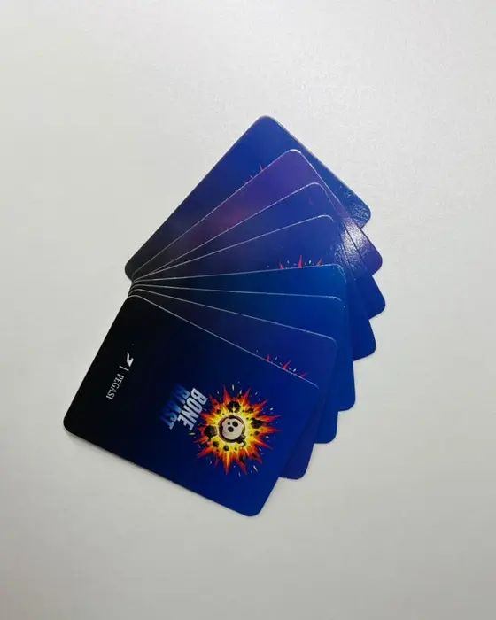 A fan of Bone Blast card backs on a table