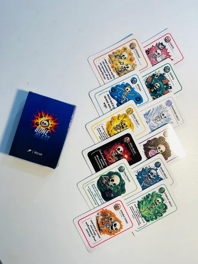 Twelve Bone Blast cards laid out next to the box